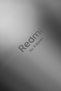 Logo of Xiaomi on a white card background.