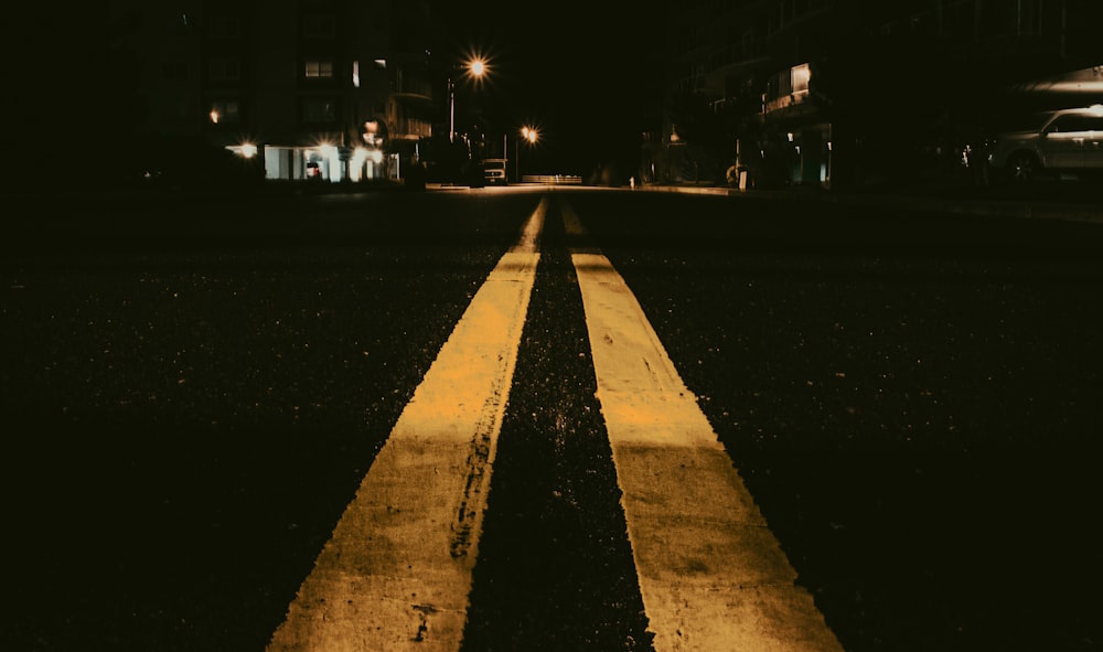 black and yellow pedestrian lane during night time