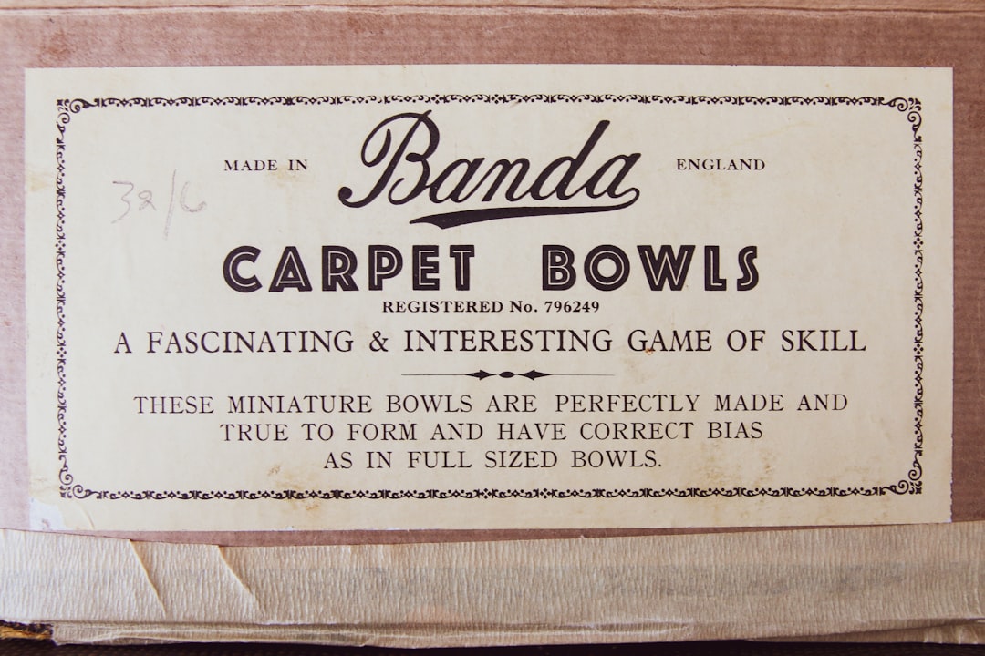 white and black printed paper, carpet bowls lid