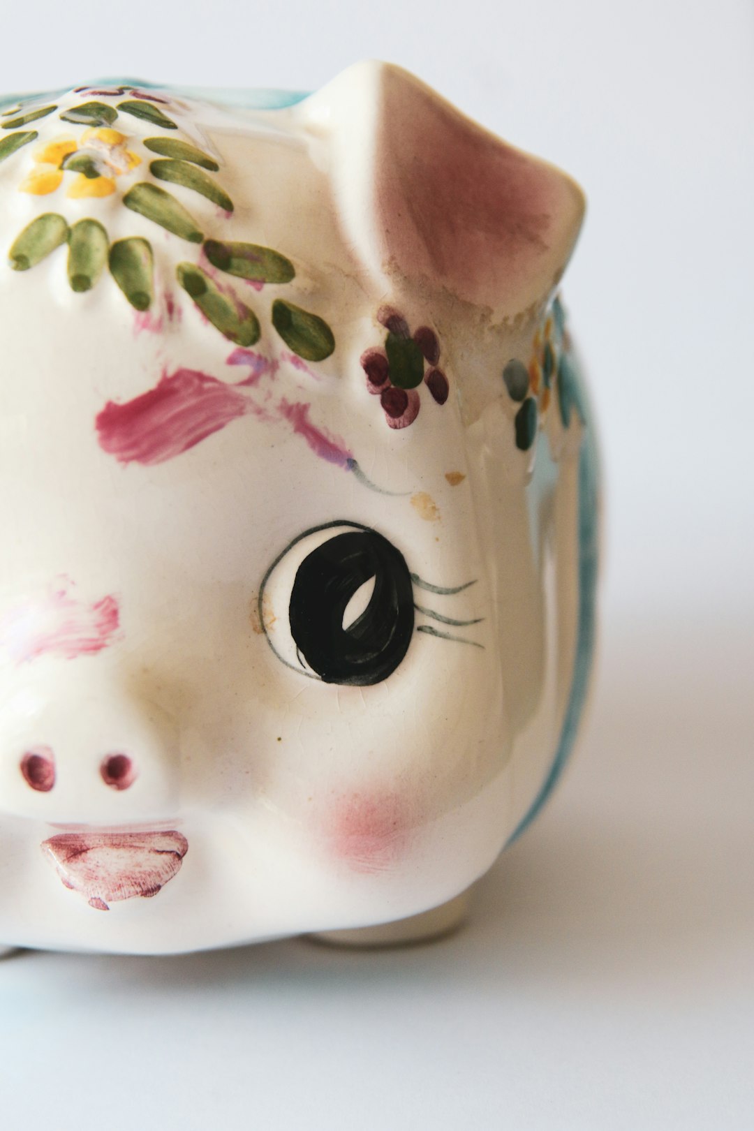 pink and green ceramic pig figurine