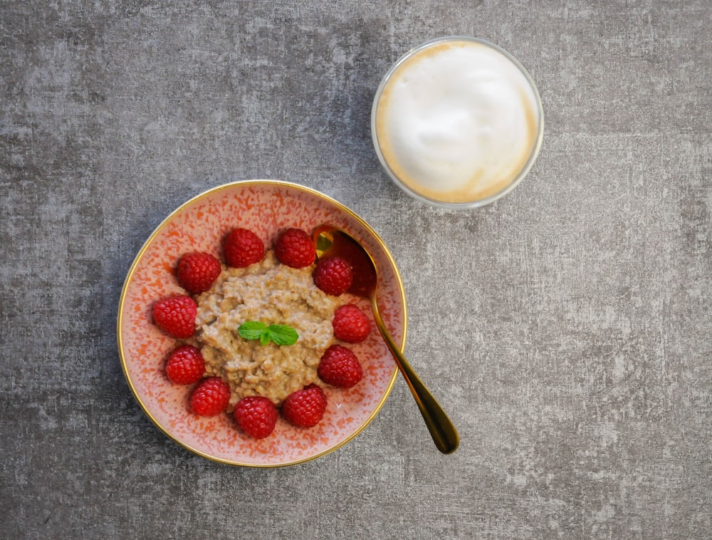 sliced strawberries on white ceramic bowl