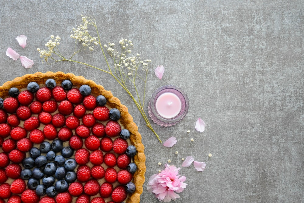 red and blue berries on brown round fruit tray