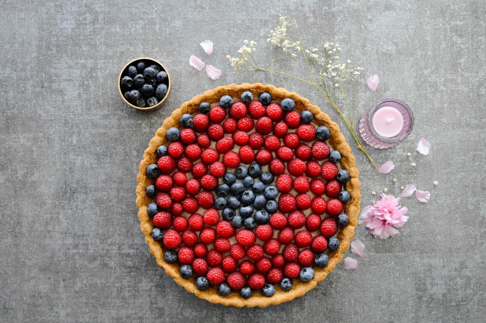 red and blue berries on brown round plate