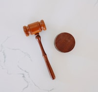 brown wooden smoking pipe on white surface