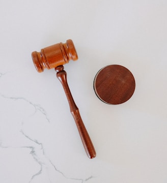 brown wooden smoking pipe on white surface