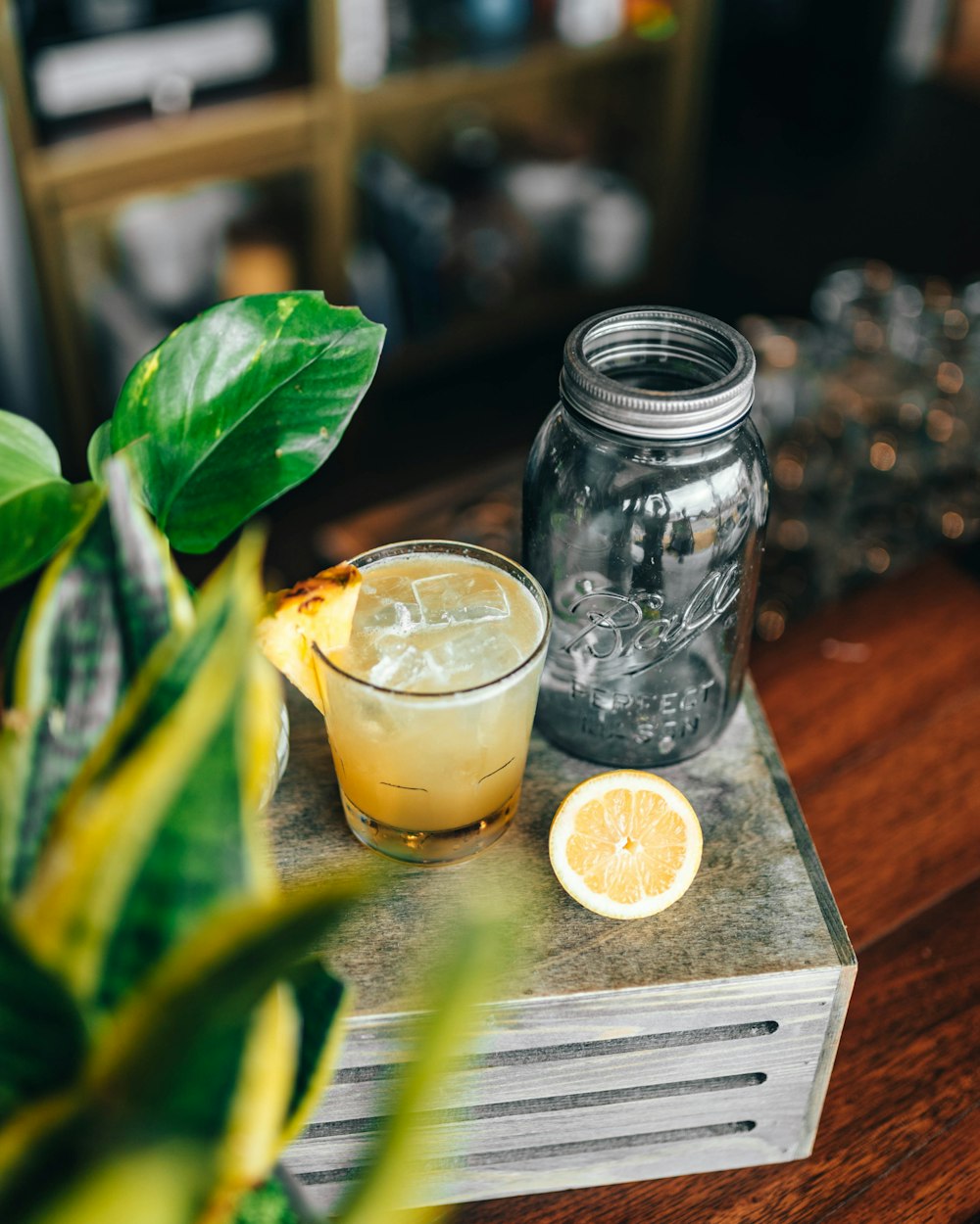 clear glass jar with yellow liquid inside