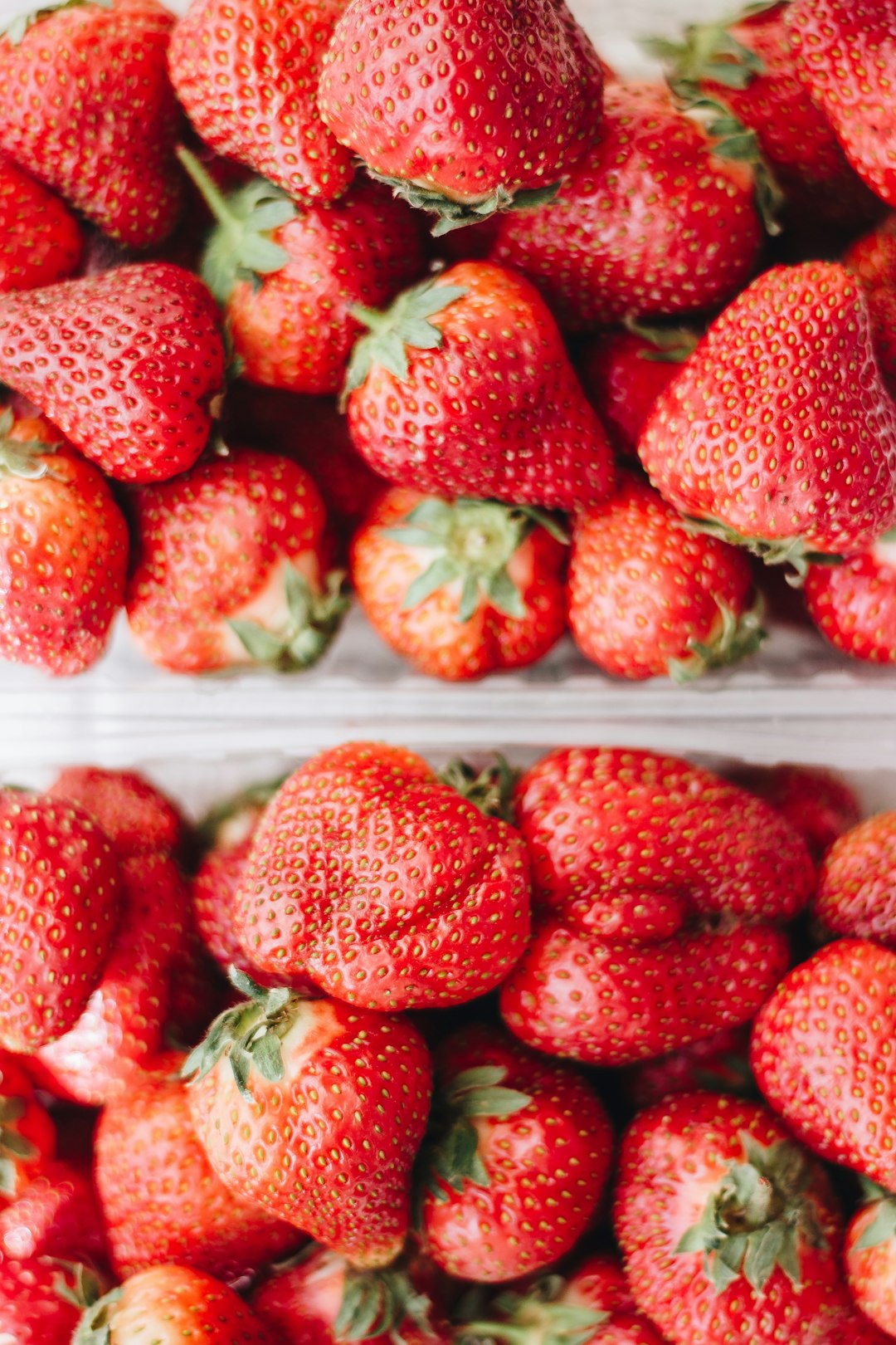 strawberries in white plastic container