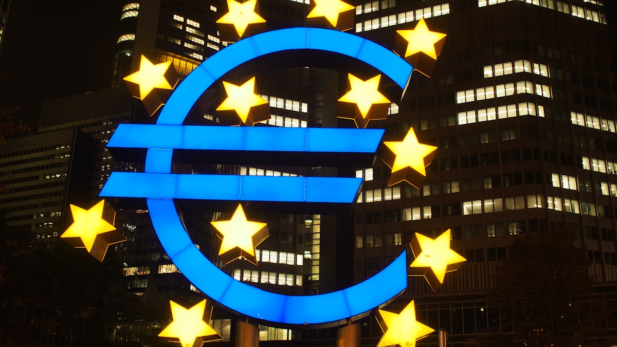 European Union flag with golden stars representing the Eurozone economic recovery