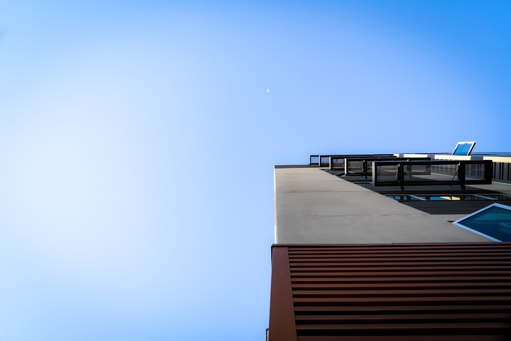 brown and white concrete building under blue sky during daytime