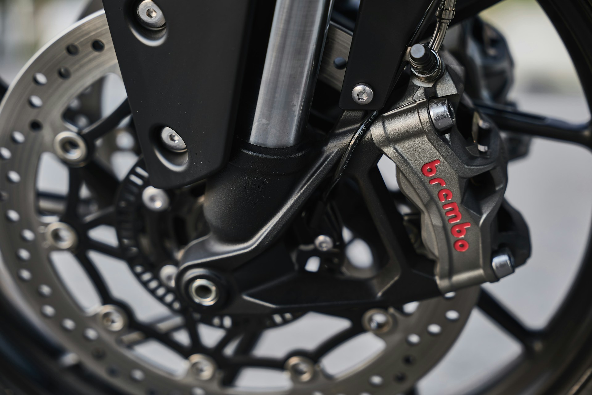 a close up of the front brake of a motorcycle