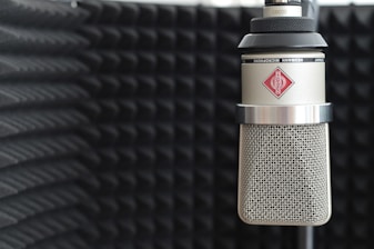 Neumann microphones arranged neatly in a sleek recording room