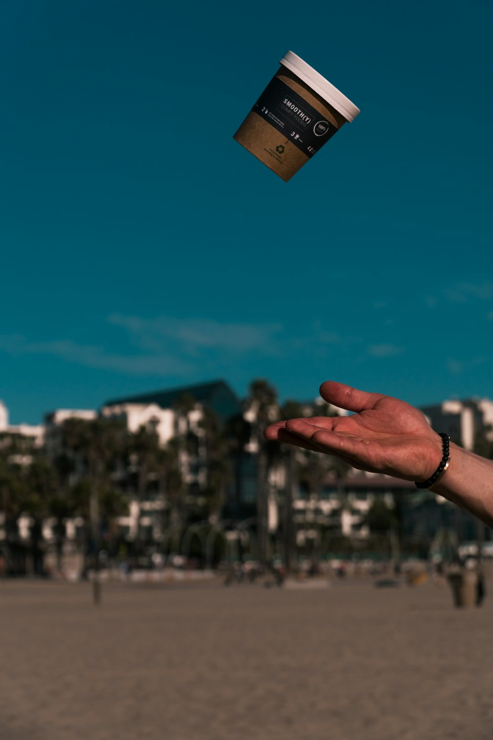 person holding gold and black padlock