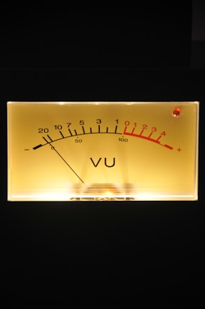 Technician using a modern sound level meter in an industrial setting.