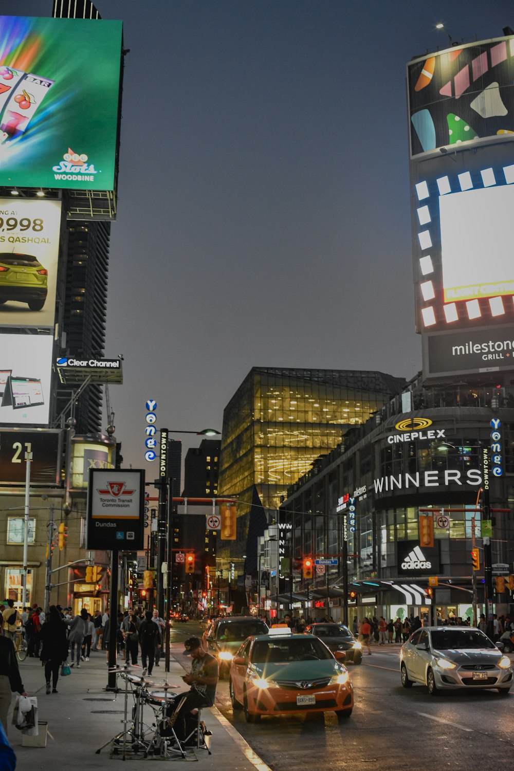 people walking on street during night time