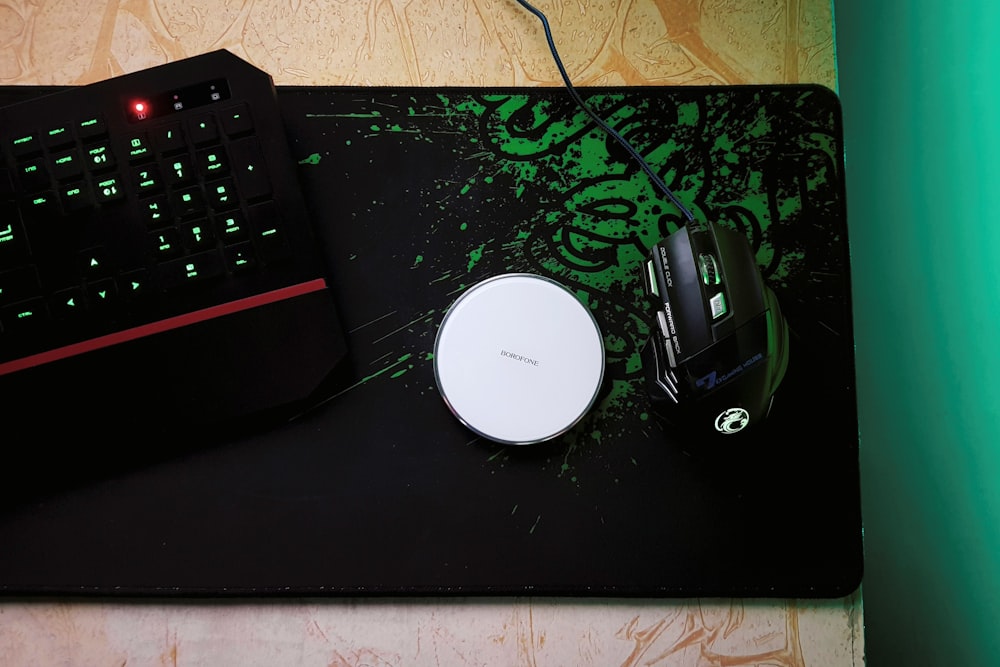 black and silver corded computer mouse beside black and silver corded computer mouse