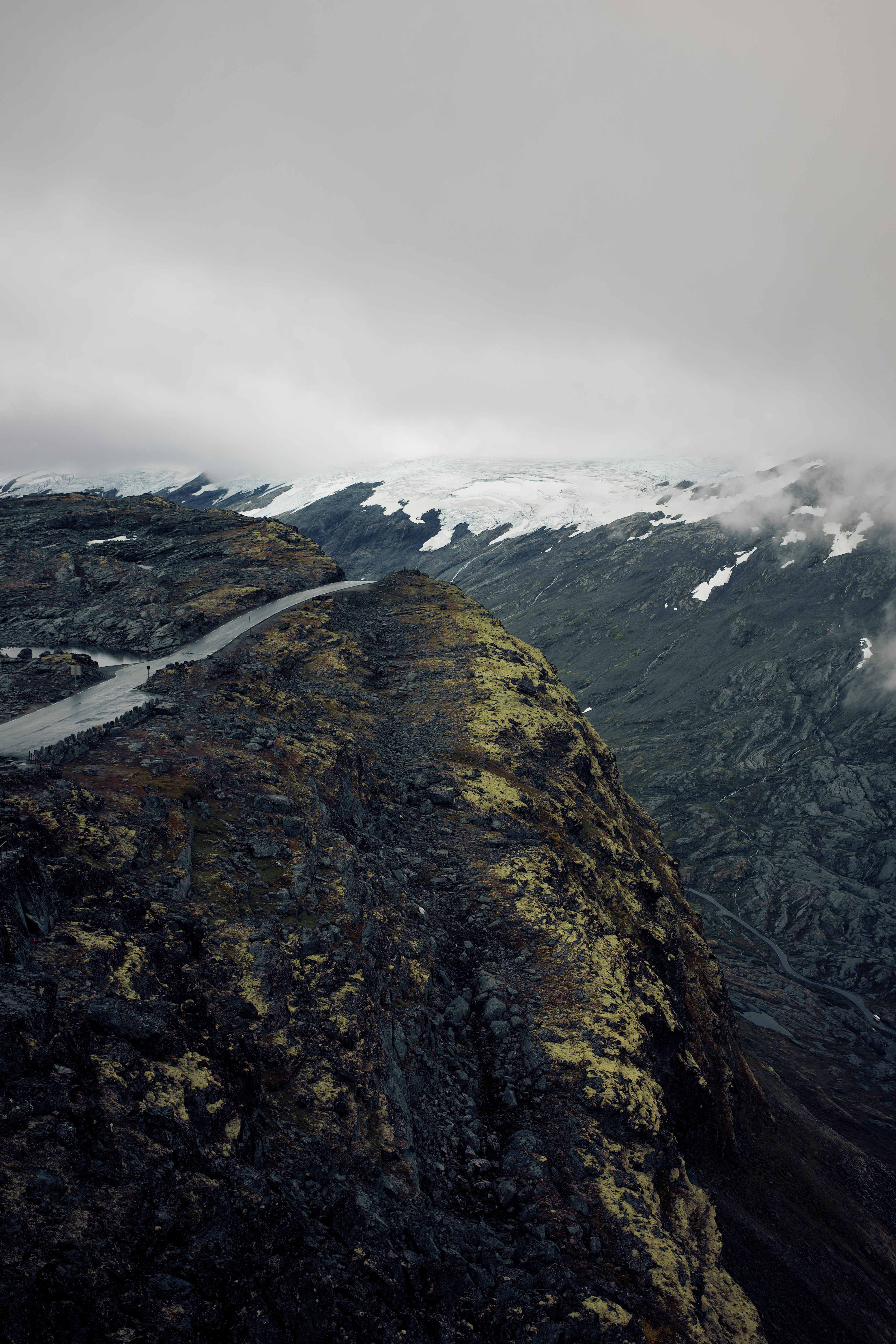 green and brown mountain under white clouds during daytime