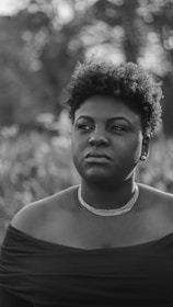 grayscale photo of man in tank top