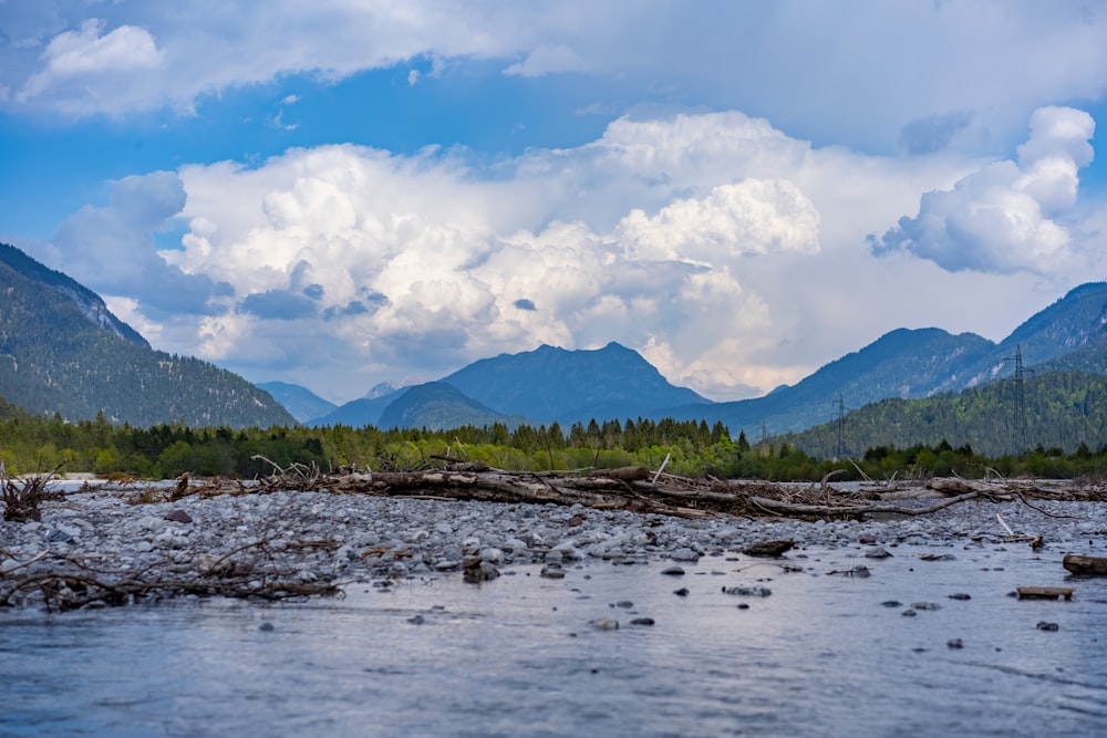 green mountains under blue sky and white clouds during daytime