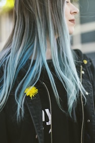 woman in black jacket with blue hair