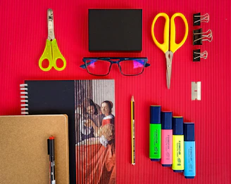 yellow plastic hair comb beside black ipad