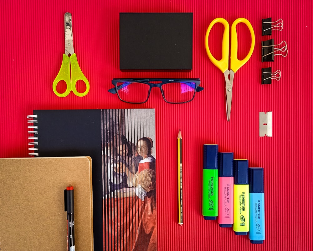 yellow plastic hair comb beside black ipad