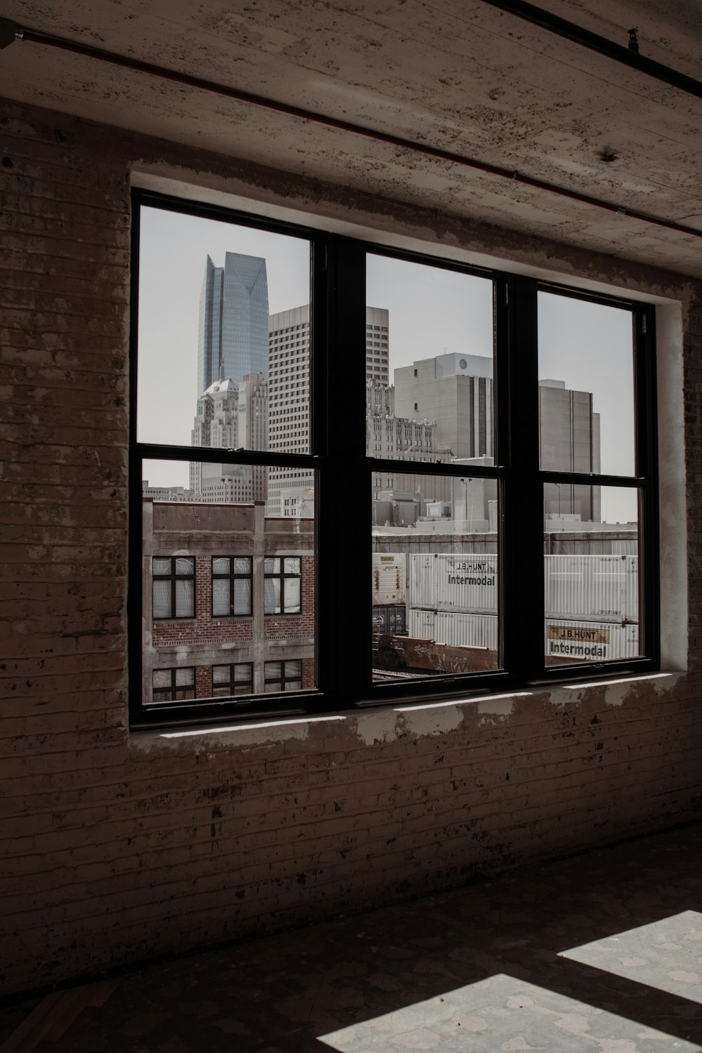 brown brick building with glass window