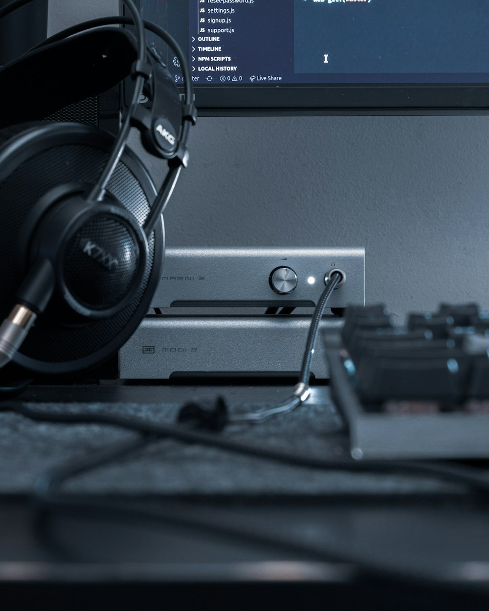 black and gray headphones on gray computer tower