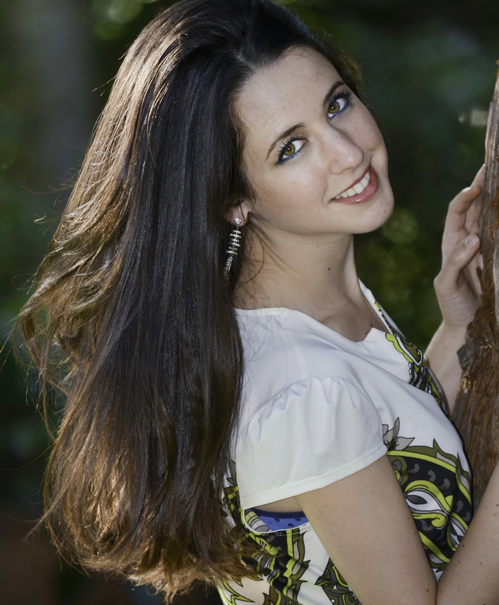 woman in white shirt smiling