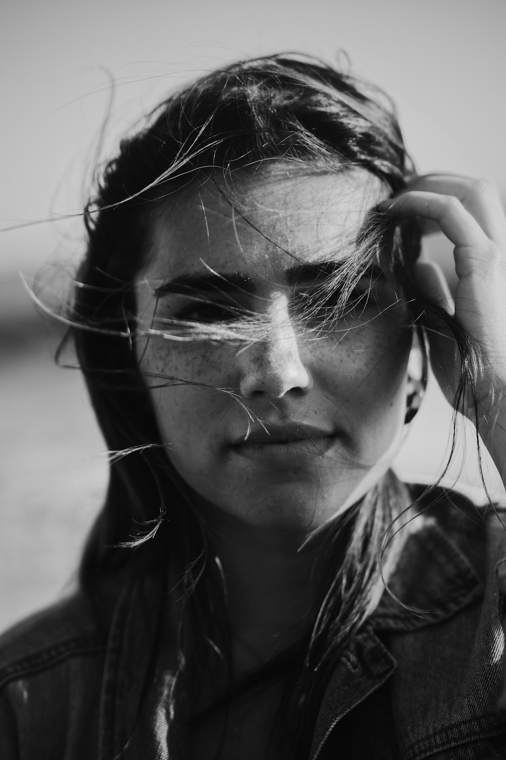 grayscale photo of girl with hair clip