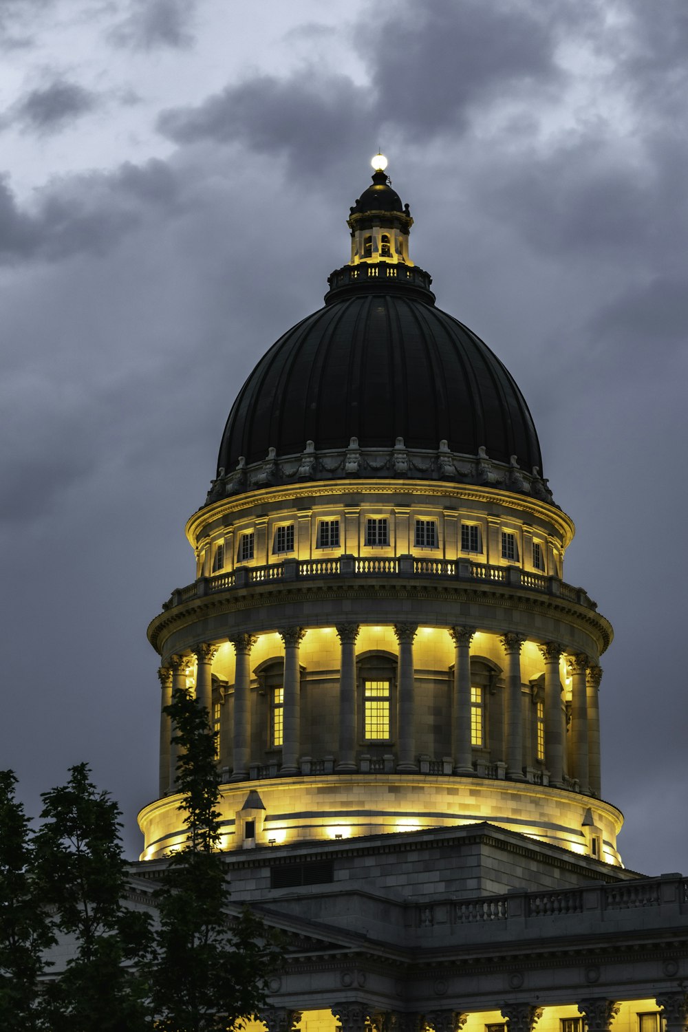 brown concrete building under cloudy sky during daytime