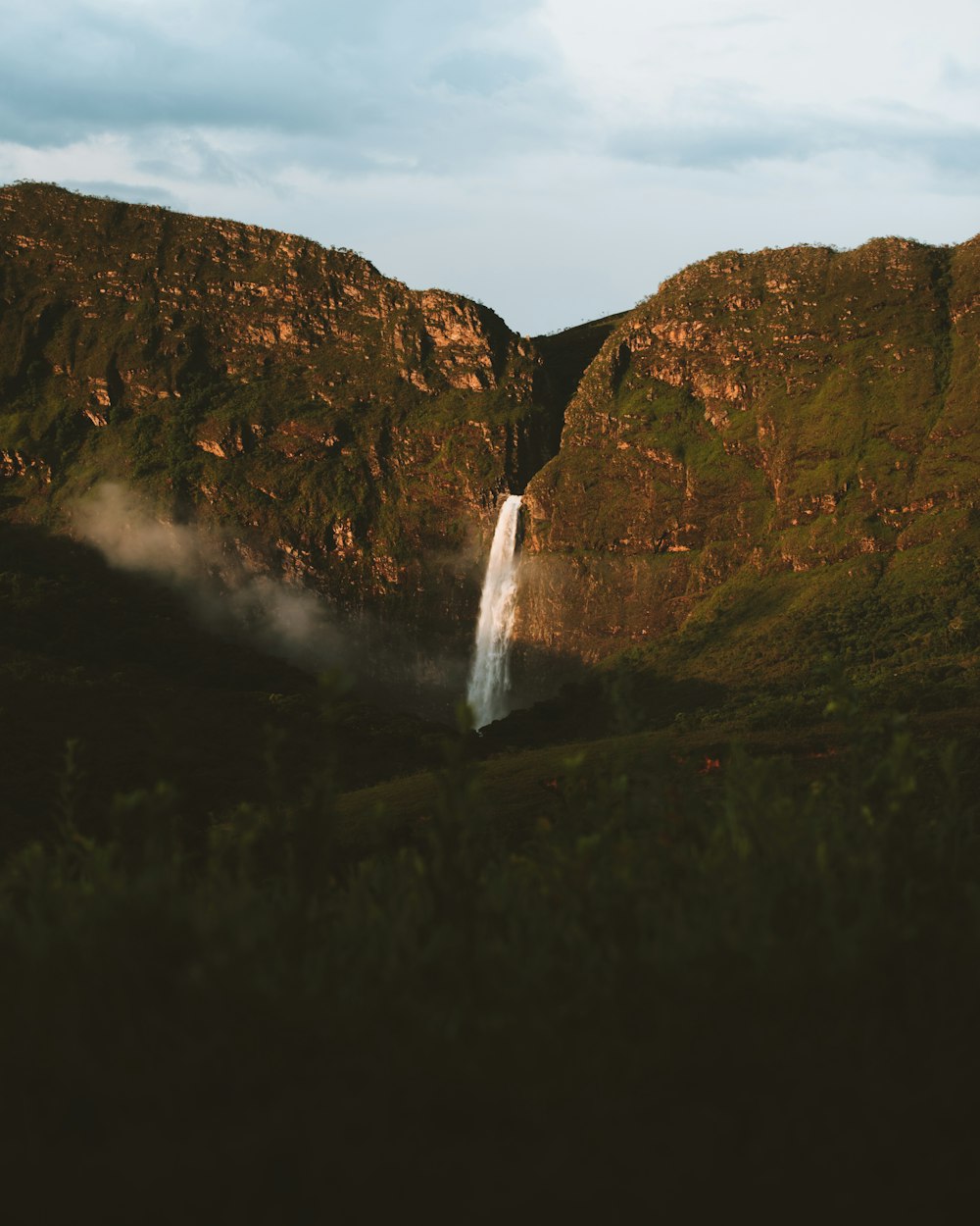 waterfalls in the middle of the forest