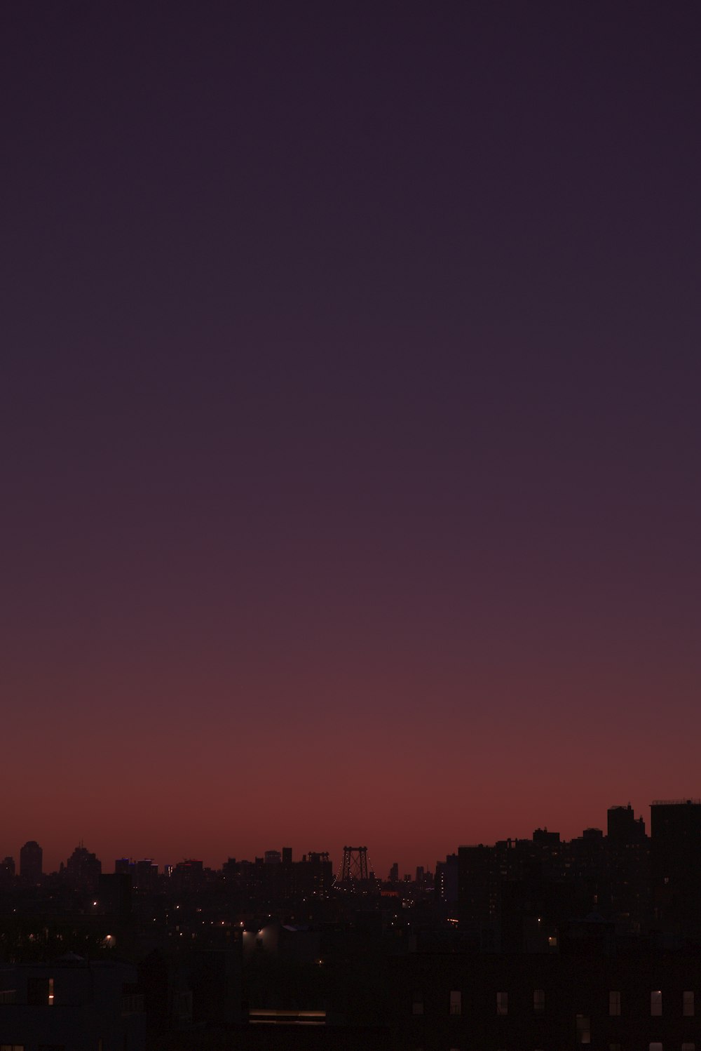 silhouette of city buildings during sunset