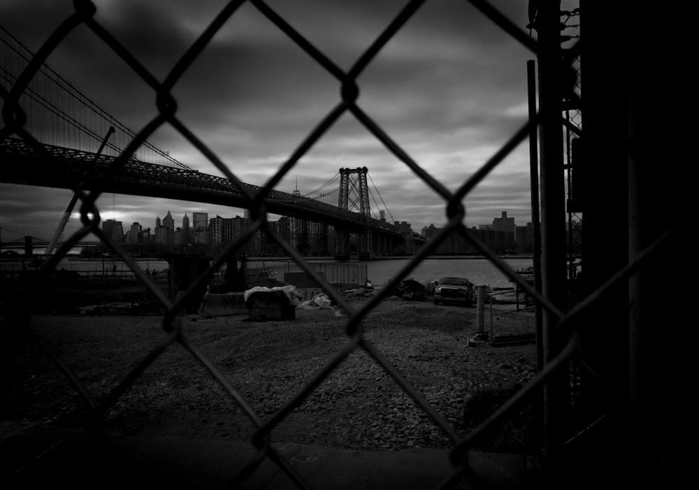 grayscale photo of metal fence