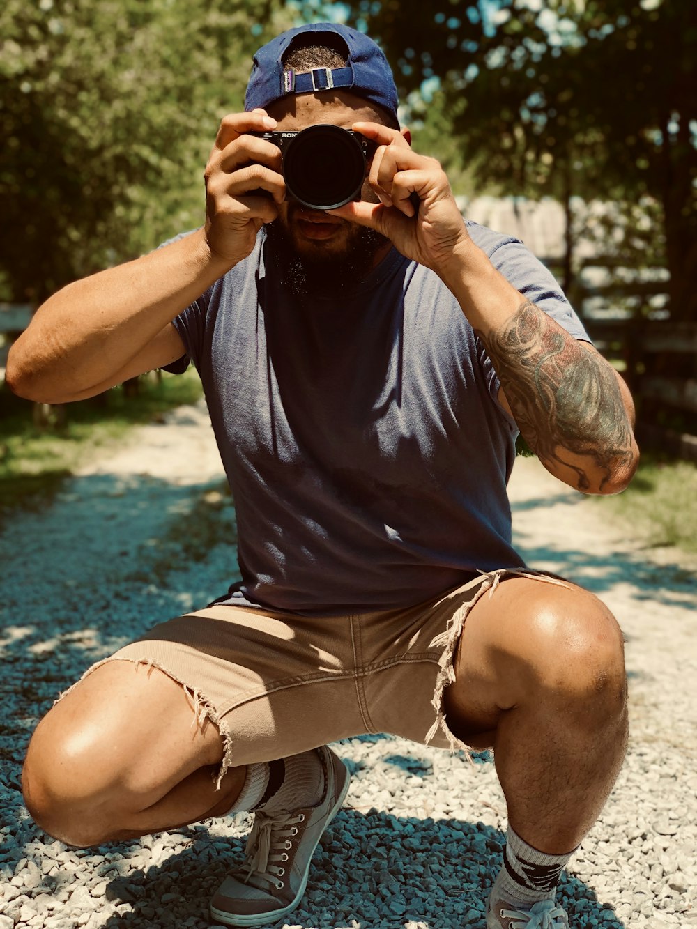 man in black crew neck t-shirt and white shorts drinking from black ceramic mug