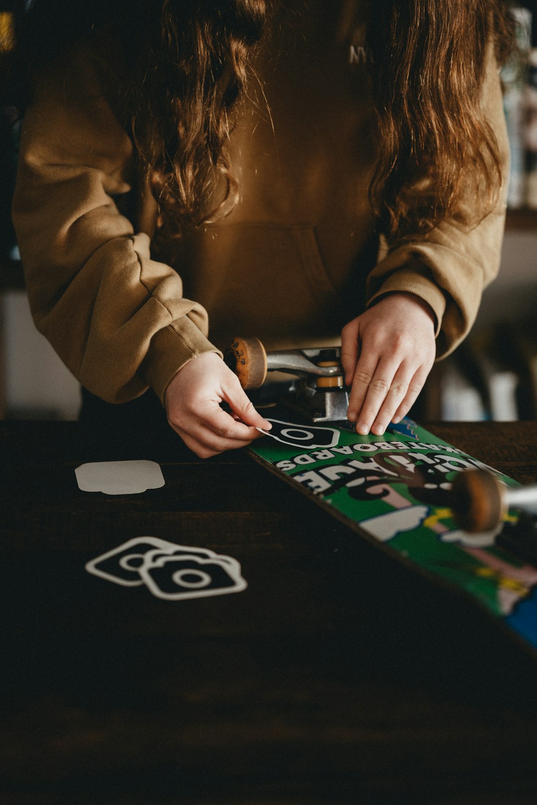 woman in brown long sleeve shirt playing game