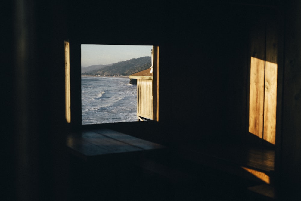 brown wooden framed glass window