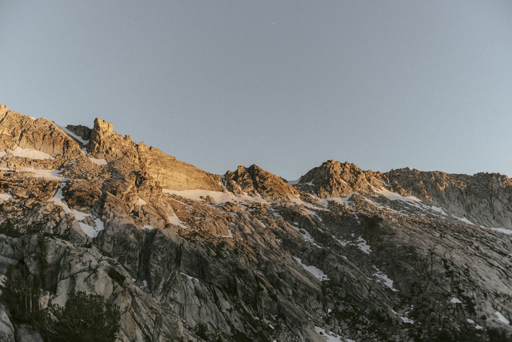 brown rocky mountain under blue sky during daytime