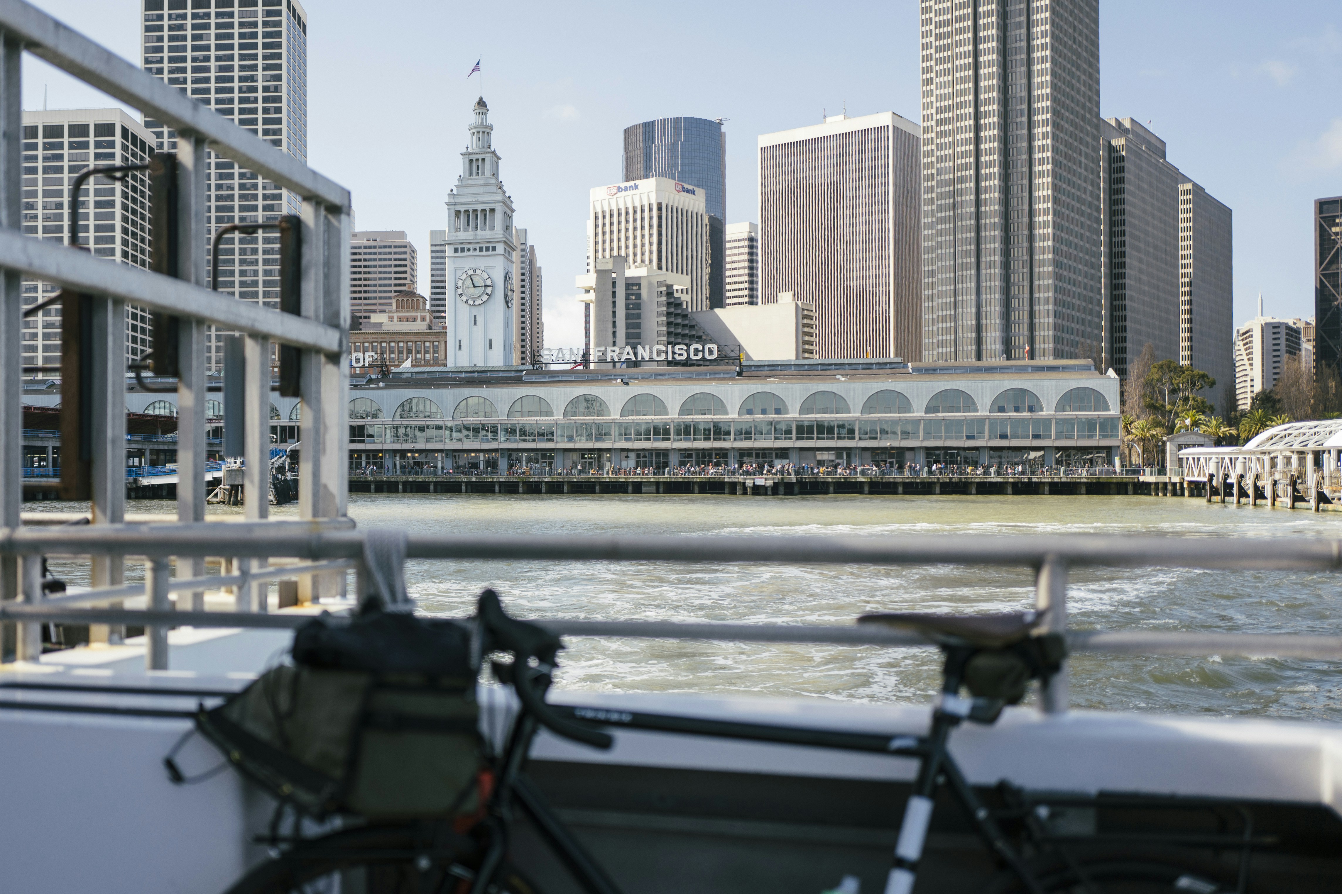 black bicycle near body of water during daytime
