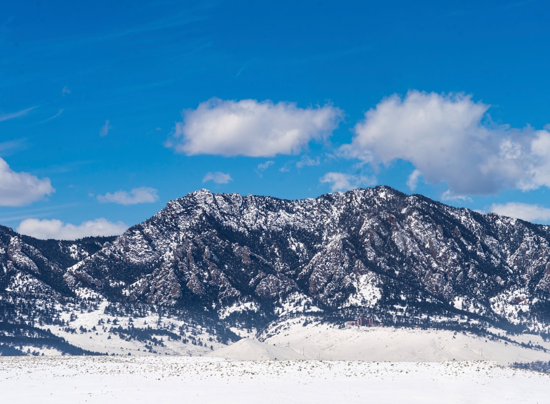 snow covered mountain under blue sky during daytime