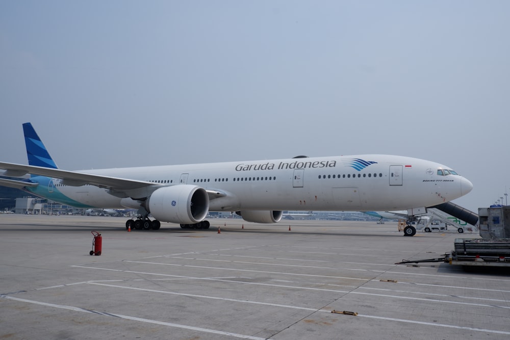 white passenger plane on airport during daytime