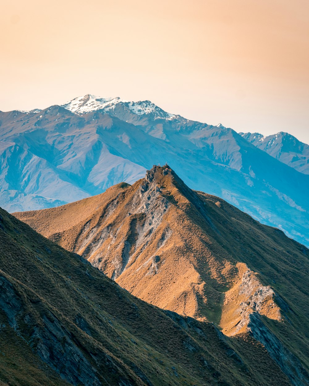 brown and gray mountains under blue sky during daytime