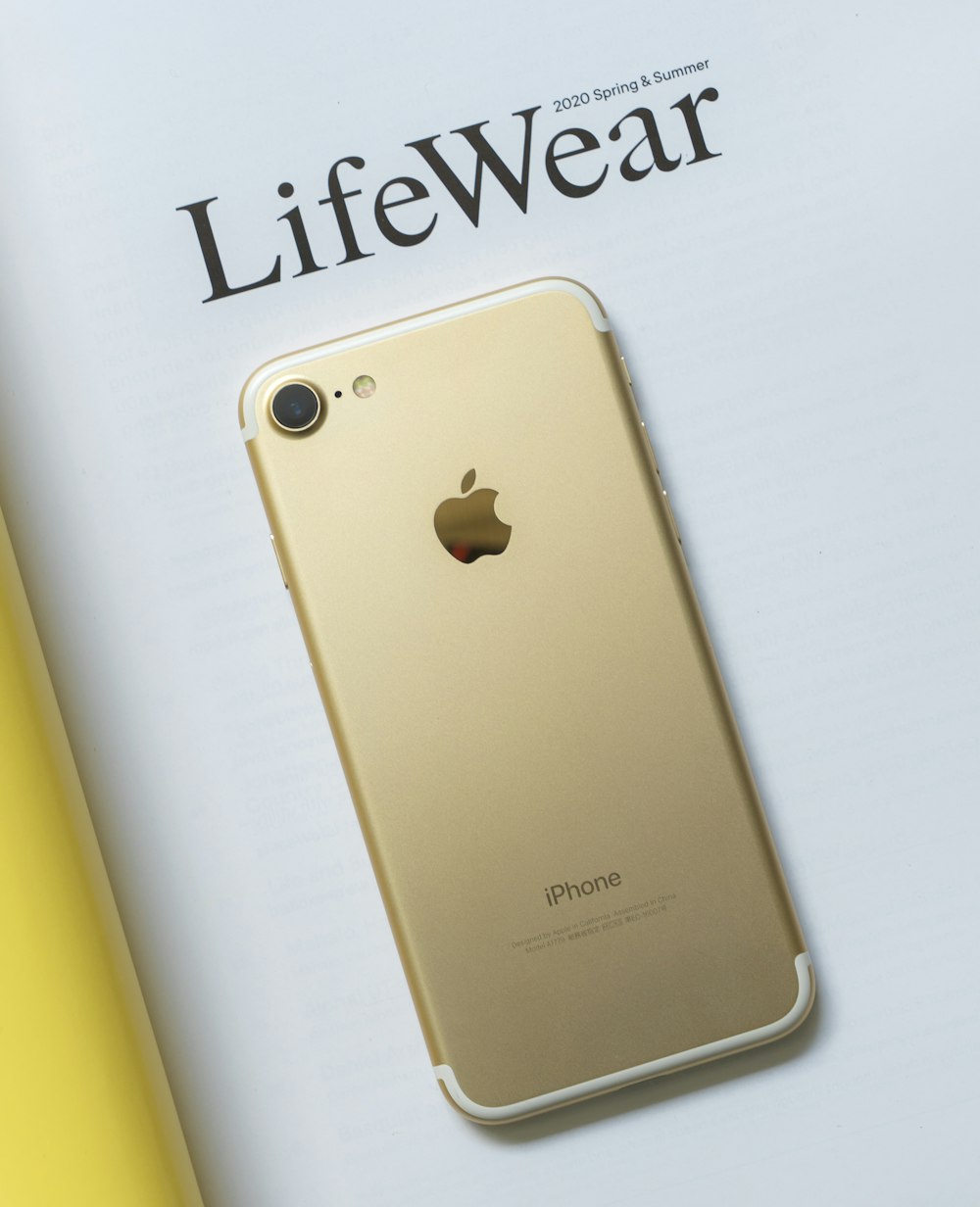 gold iphone 6 on white surface