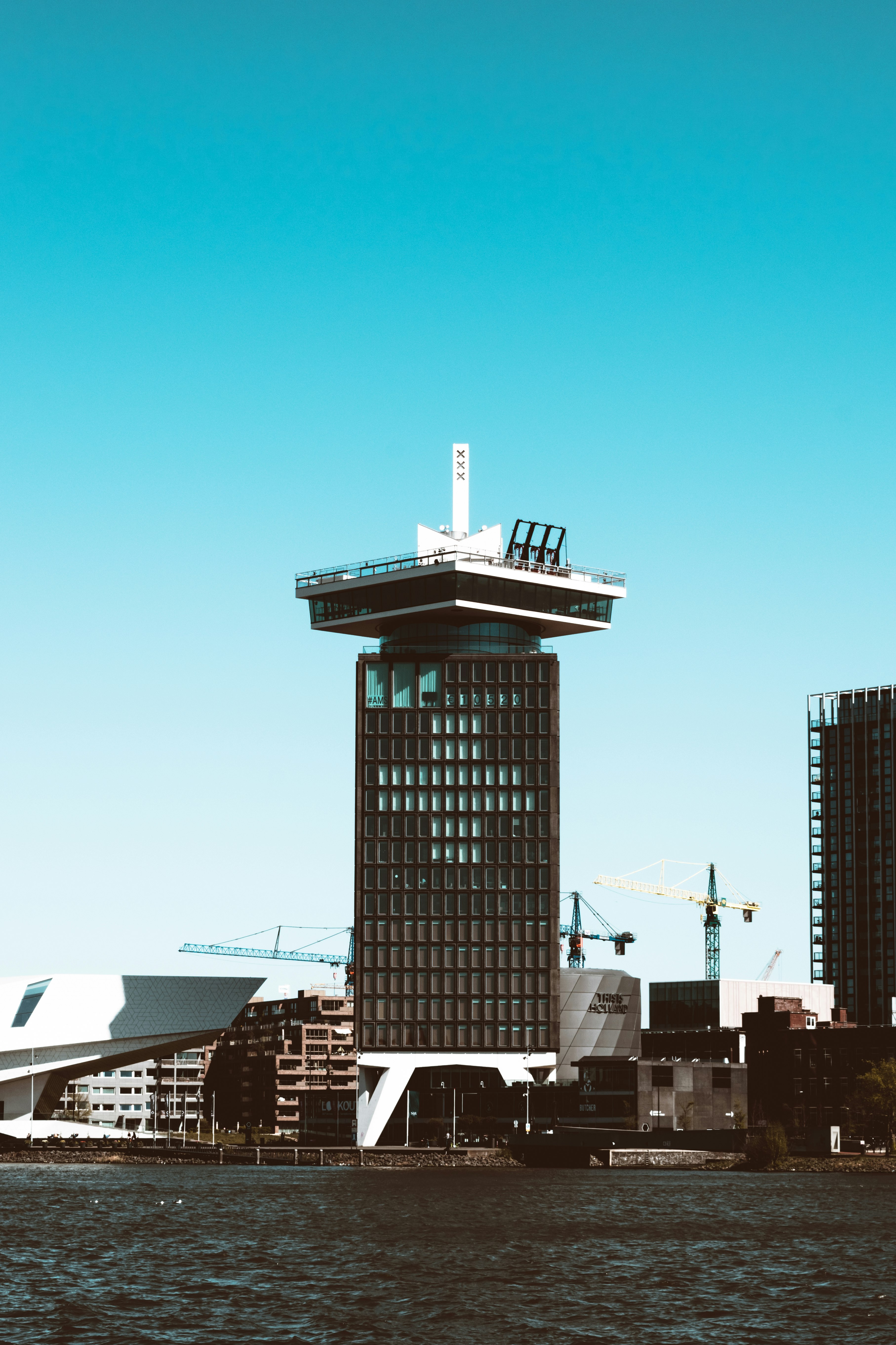 black and white concrete building under blue sky during daytime