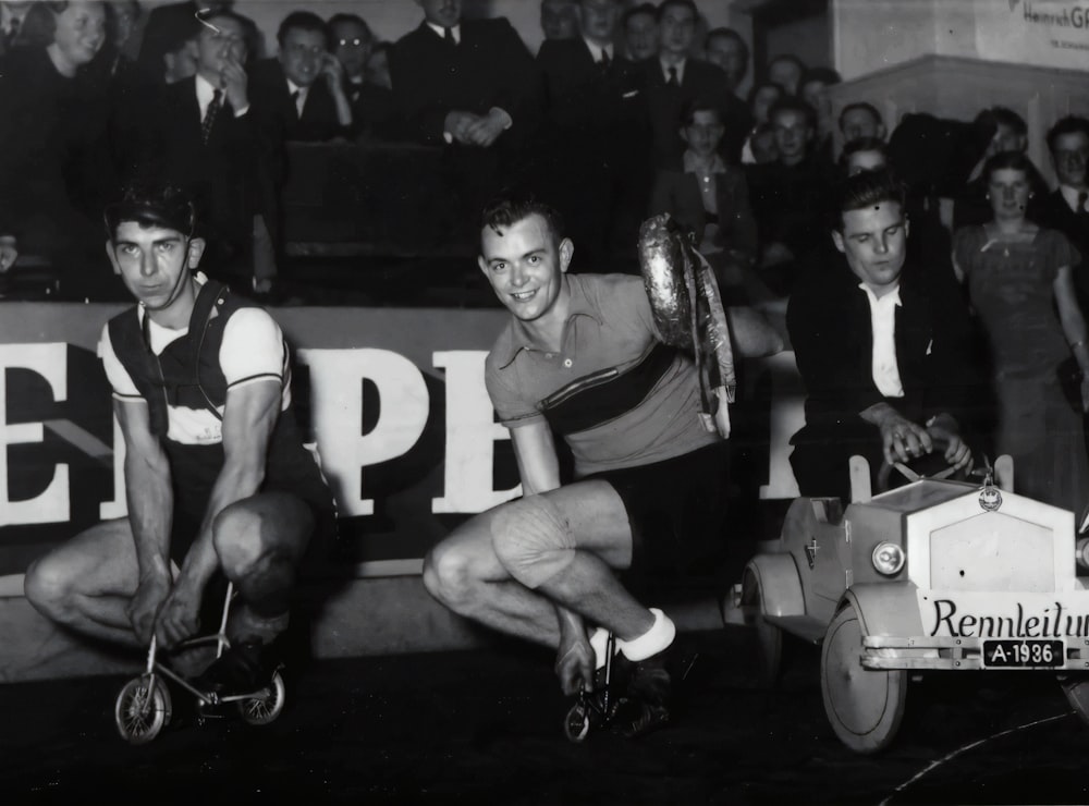 man in black and white jersey shirt sitting on black and white motorcycle