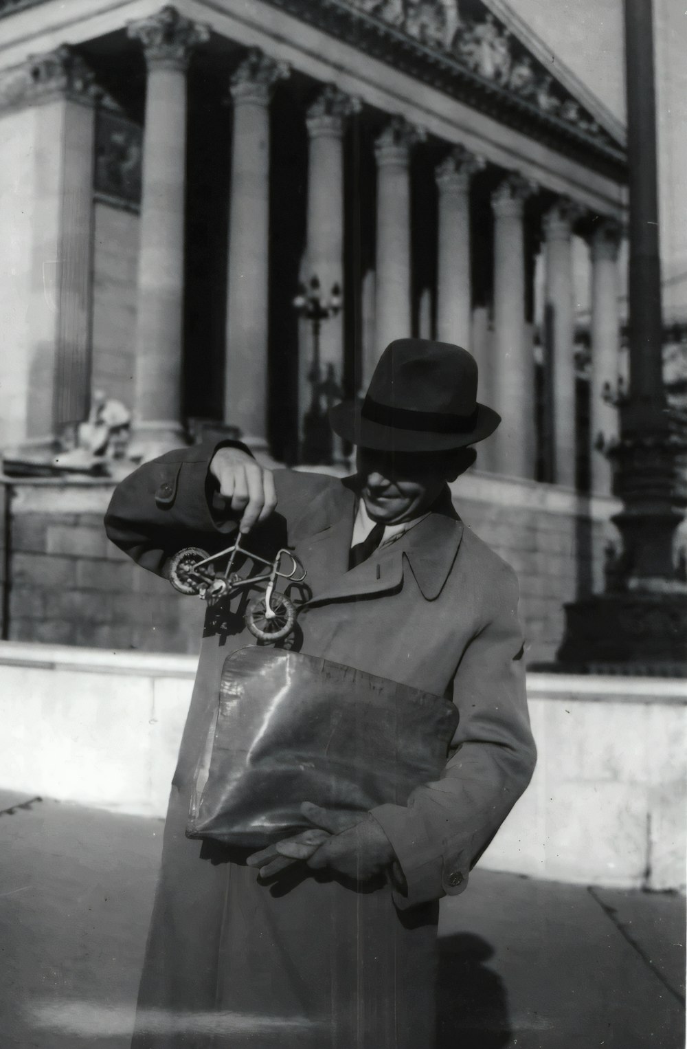 man in black hat and coat