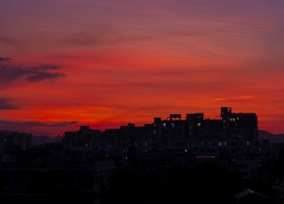 silhouette of city buildings during sunset