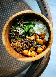 cooked food in brown wooden bowl