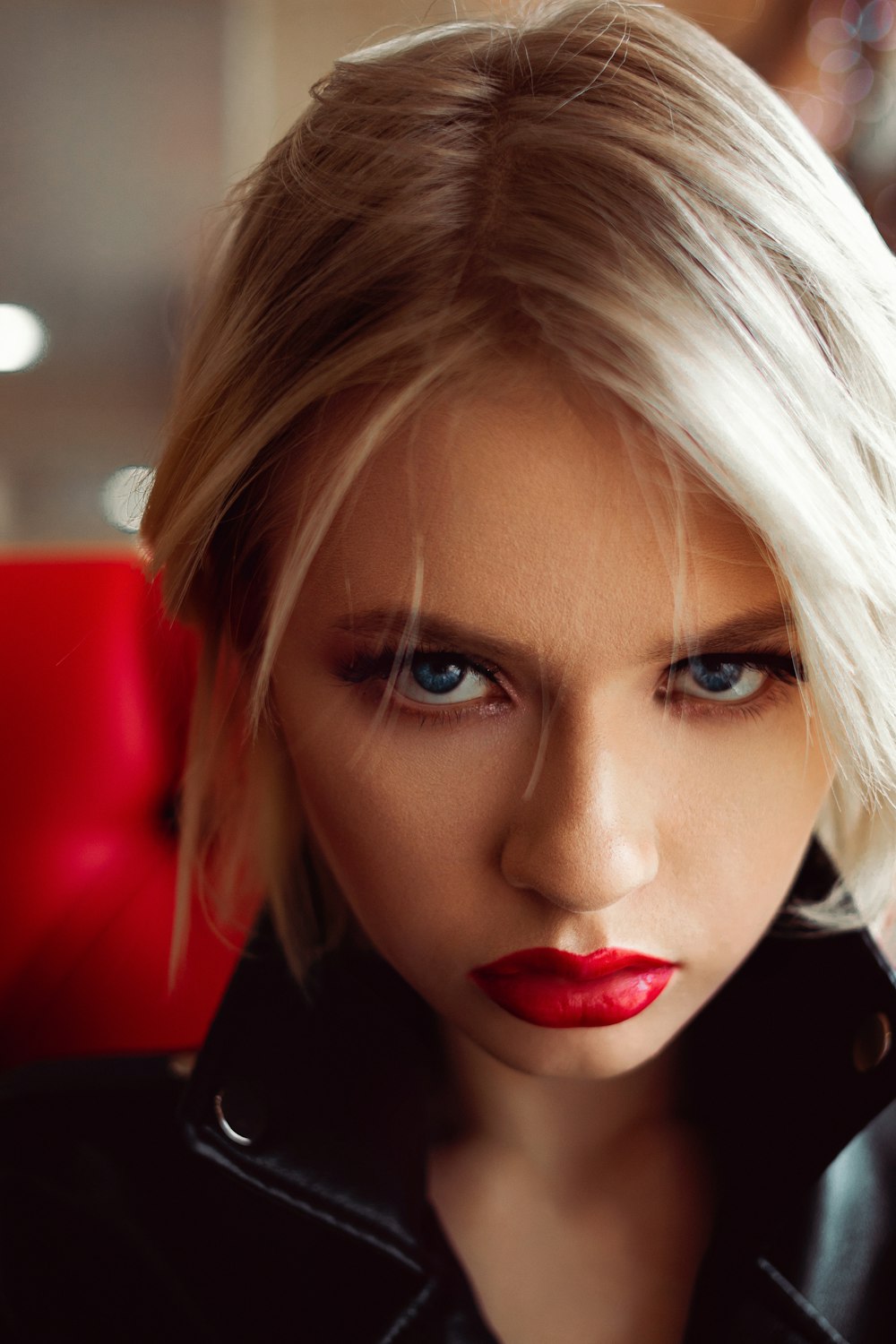 woman with blonde hair wearing red lipstick