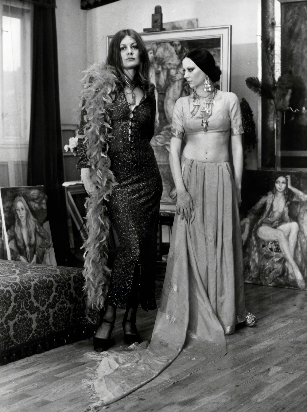 woman in black and white dress standing beside woman in black and white dress