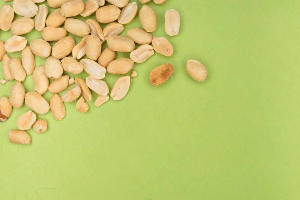 brown nuts on green surface